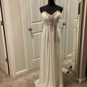 Elegant White Strapless Gown with Silver Embellishments